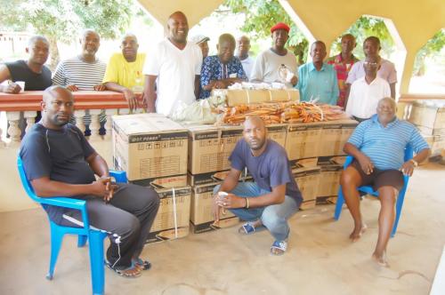 A cross section of members of Obioha family with items donated by the Adure and Onyima Obioha Foundation during the Easter season.